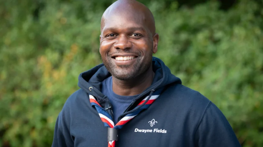 Dwayne Fields, adventurer, TV presenter, and Chief Scout congratulates Thamesmead volunteers